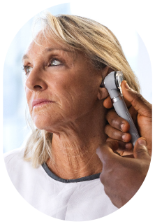 An older woman receiving a tinnitus assessment